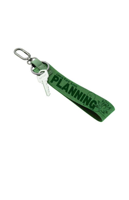 Green PSA - Planning Lotus Lanyard with a metal clip and key, featuring “uwaterloo PLANNING” and a lotus icon.