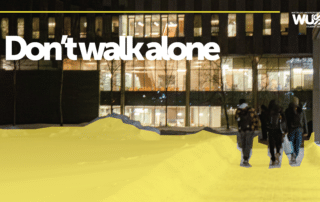People walking outside a building at night with the WalkSafe text “Don’t walk alone” and the WUSA logo.