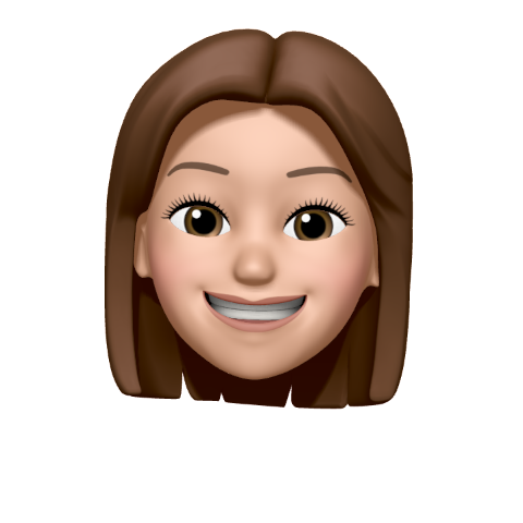 Memoji of a smiling person with brown hair.
